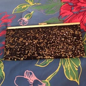 Gold and black sequence clutch