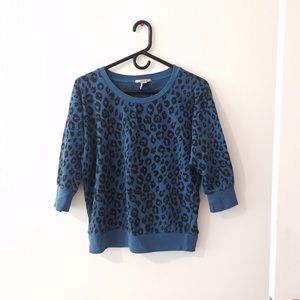 A cheetah print sweater