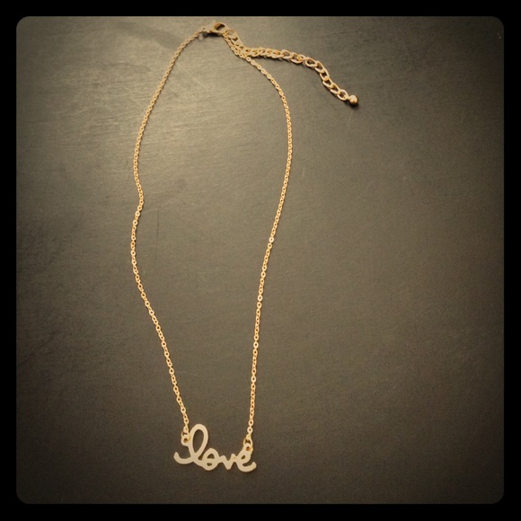 Gold tone "love" necklace