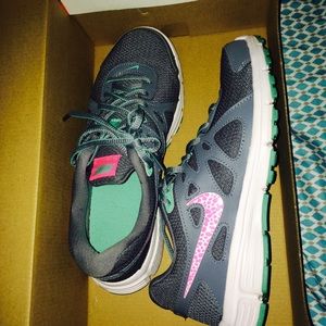 Never worn Nike revolutions