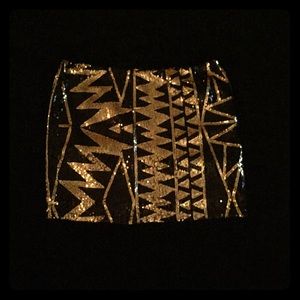 Black and gold sequin mini skirt. Black and gold sequin mini skirt.
