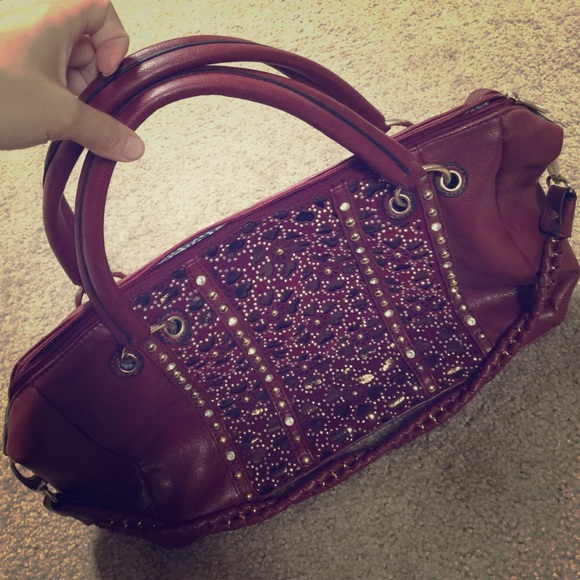 Maroon colored purse with crystal front