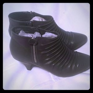 Brand new never been worn.  Heeled low boot/shoe.