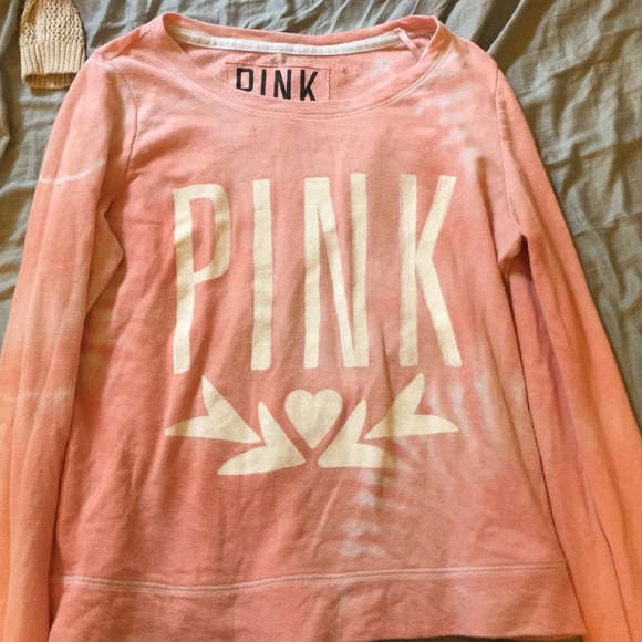 A loose pink sweater