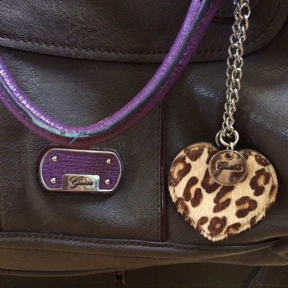 grey and purple medium sized guess purse
