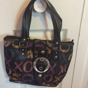 Black XOXO bag with colorful XOXO writing