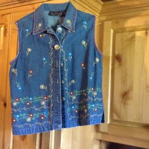 Jean vest with floral design.