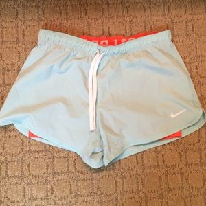 Light blue and coral Nike Dri-Fit shorts