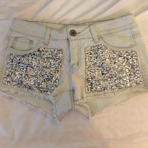 Sequined denim shorts.