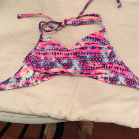 Pink brand criss cross swim top never worn.