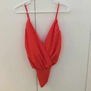 Coral colored open back bodysuit