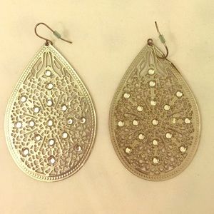 Silver teardrop-shaped earrings.