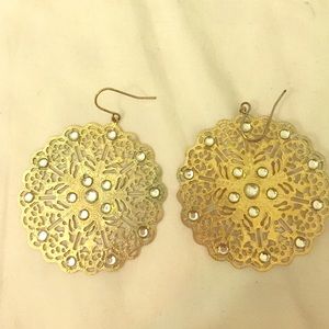 Gold earrings.