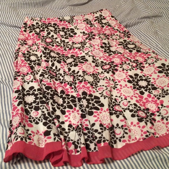 White, with pink and black flowers skirt