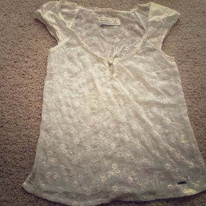 White top with floral print.