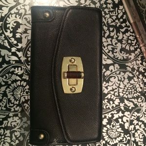 Black gold and tortoise wallet
