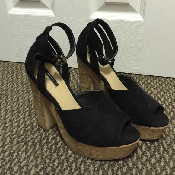 Black strappy heel with a chunky wedge type heel