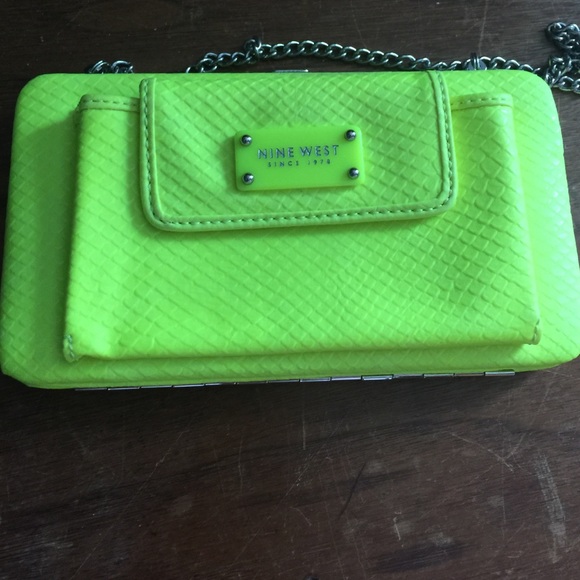 Neon yellow clutch with phone holder.