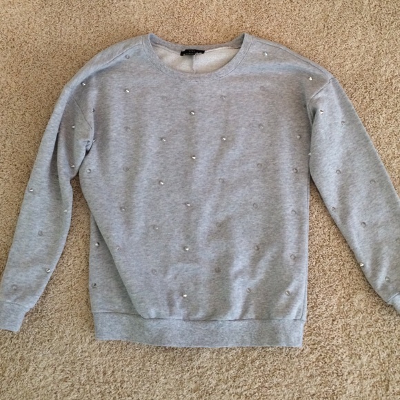 grey sweater with spikes