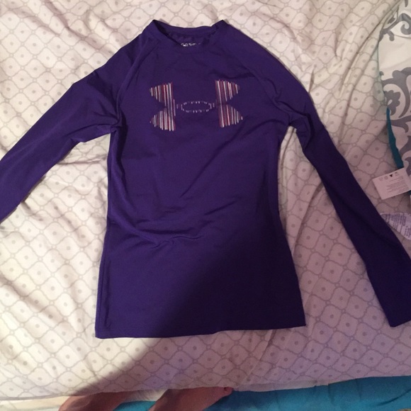A dark purple long sleeve under armour top