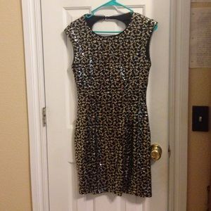 Gold and black sequin party dress.