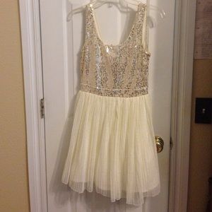 Gold and white sequin dress.