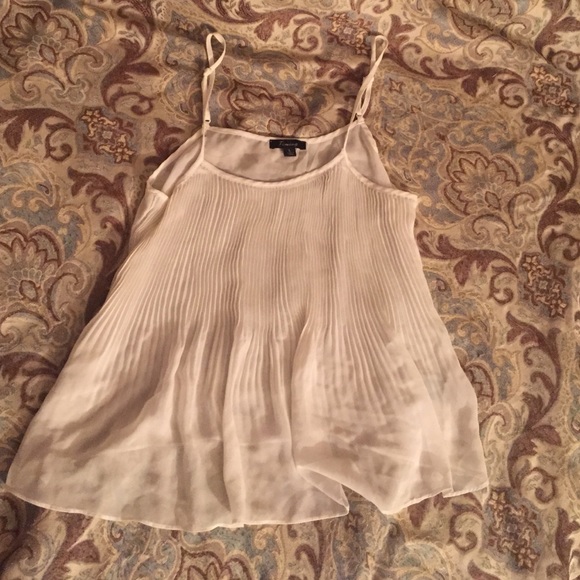 White tank, very sheer.