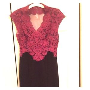 A fitted lace dress. Mauve and black.