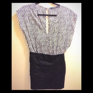Black and white mini dress with open slit back.
