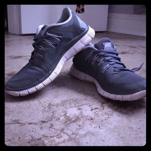 Grey and light blue Nike free 5.0.