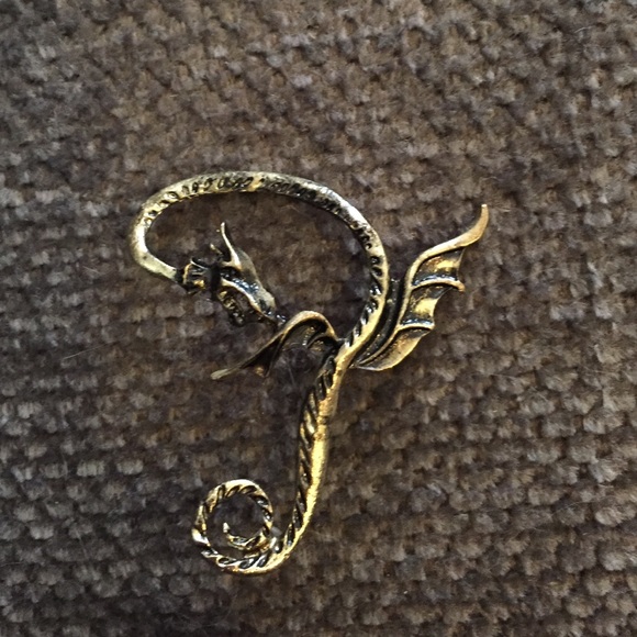 Golden earring in shape of a dragon