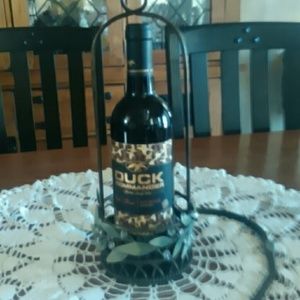 Wine holder...comes with hanger or can sit to