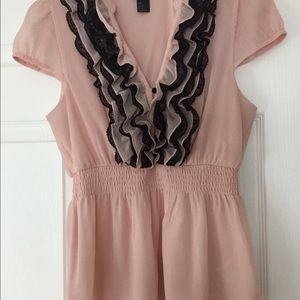 Adorable light pink blouse with black ruffle