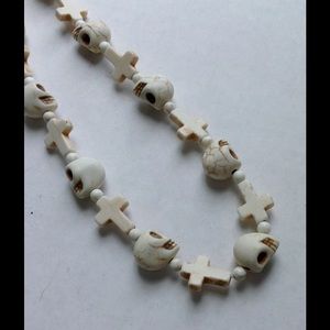 Gothic skull and cross bone-like necklace