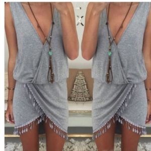 Tshirt dress. Feather fringe detail.