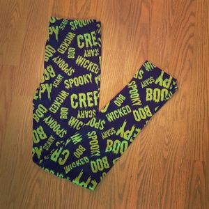 Black and green silky Halloween leggings.