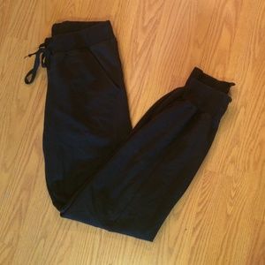 Black Adidas sweatpants.