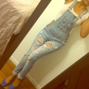 Skinny jean overalls.