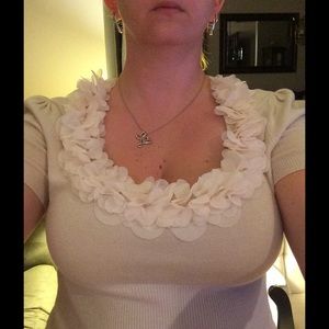 Flirty cream colored ruffle shirt