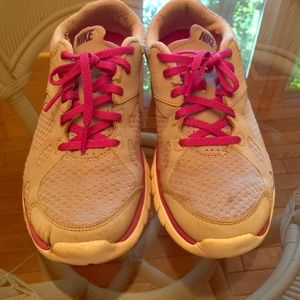 Dark and light purple Nike tennis shoes
