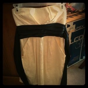 Strapless off-white dress with black tie