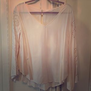 Ivory blouse with cut out designed sleeve