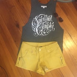 Yellow denim shorts with white embr heart pockets