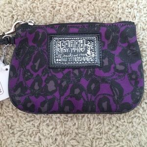 Purple and black coach clutch