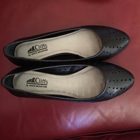 Black flats with small triangle cut outs