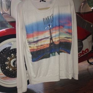 White sweater with 'Paris' on it