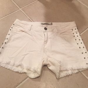 White studded denim shorts