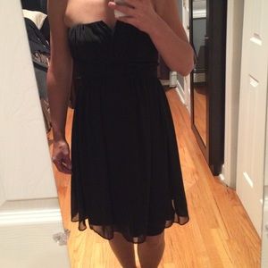 Strapless black dress with knot detail