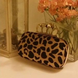 Leopard clutch with rings' handle