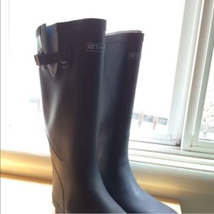 Tretorn brand new size ten rain boots never worn.